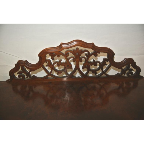 41 - Victorian walnut bow fronted three tier whatnot with ornate pierced fretwork back, turned finials, t... 