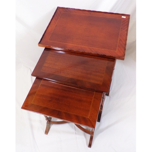 51 - Edwardian inlaid mahogany nest of three tables on spindle columns with bracket feet