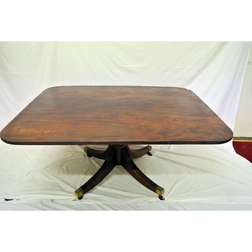 55 - Georgian mahogany library or dining table with tip-up top, rounded corners, raised on turned taperin... 