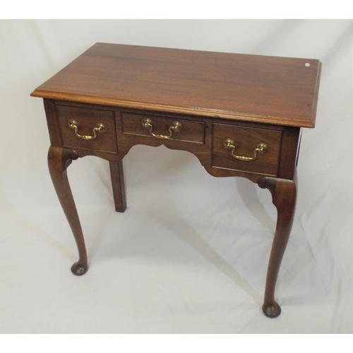 69 - Edwardian mahogany lowboy with three drawers, brass drop handles, on cabriole legs with pad feet