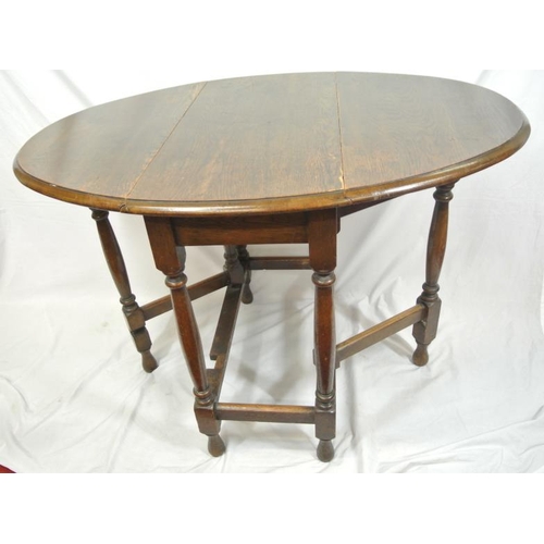 74 - Victorian oak Pembroke table with D-shaped drop leaves, gateleg support, with turned columns and leg... 