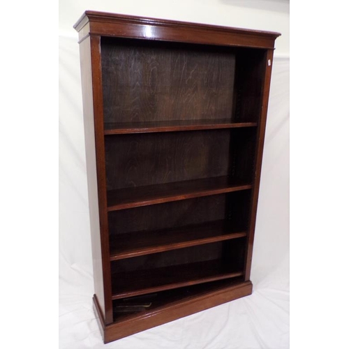 85 - Edwardian mahogany bookcase with adjustable shelving, on oblong plinth