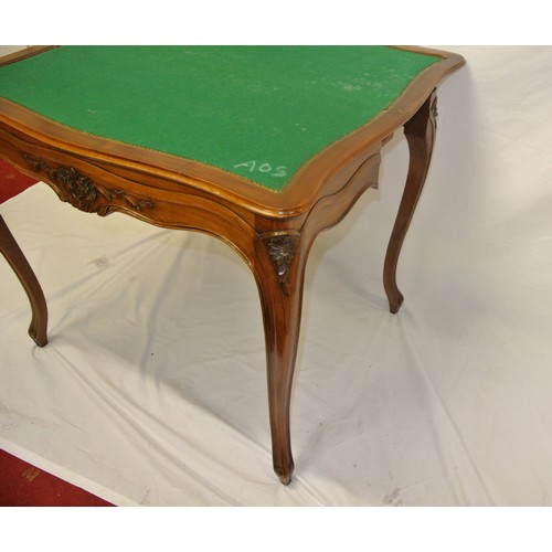 90 - Edwardian mahogany tea table with serpentine sided fold-over top, baize surface, foliate carving, on... 