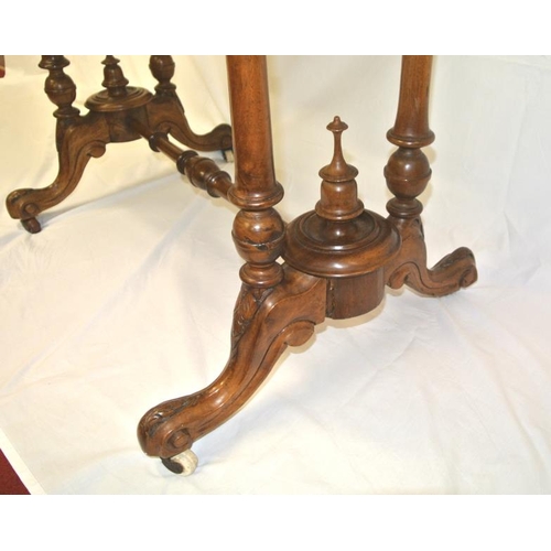 136 - Victorian mahogany and walnut serpentine shaped oblong occasional table with turned tapering columns... 