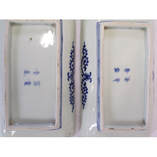 162 - Set of four Asian oblong dishes with blue and white foliate decoration