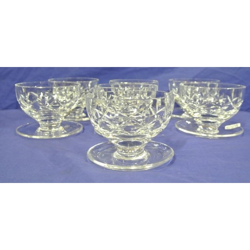 174 - Set of seven Waterford Crystal cut glass sundae glasses with faceted decoration and rounded bases