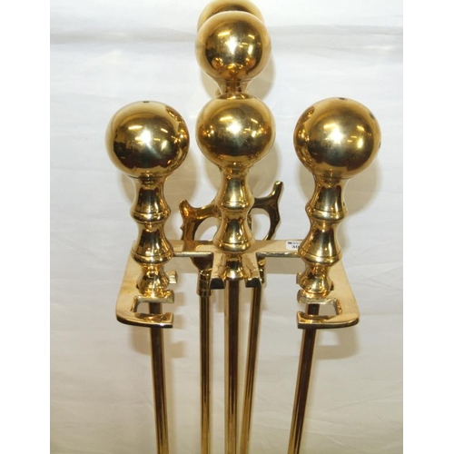 177 - Edwardian style brass companion set on stand with ball shaped tops and rectangular base