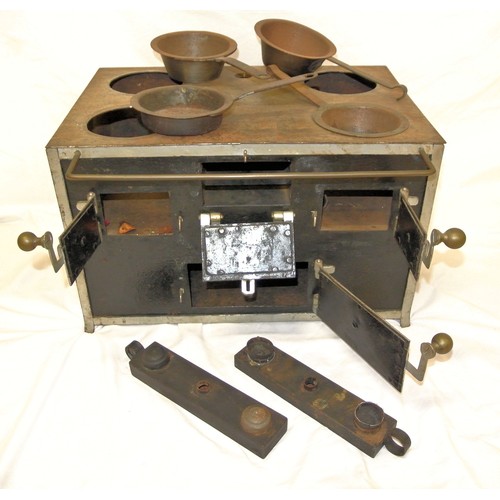 182 - Cast iron miniature camping stove with brass mounts and doors