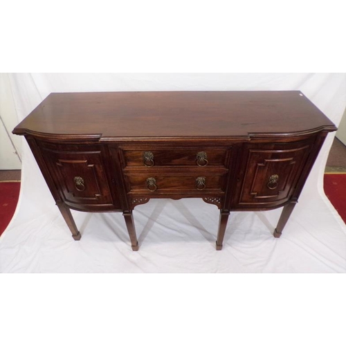 185 - Edwardian mahogany breakfront sideboard with two central drawers, side presses with ornate brass lio... 