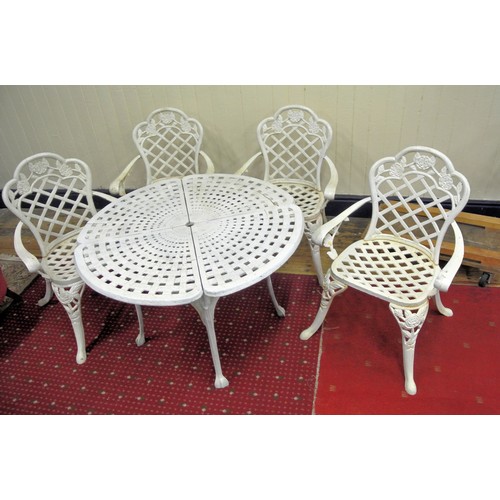 187 - Five piece cast iron garden or patio suite - round table and four armchairs with rose decoration