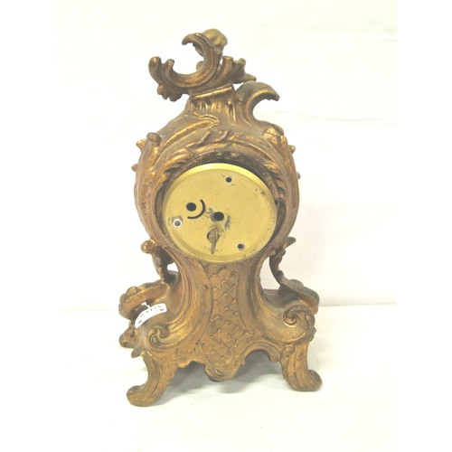 201 - French style ormolu mantel clock with cherub and foliate decoration, circular enamel dial, and shape... 