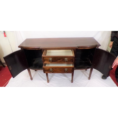 185 - Edwardian mahogany breakfront sideboard with two central drawers, side presses with ornate brass lio... 