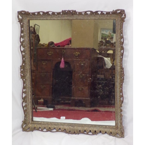 193 - Ornate Victorian style wall mirror in ornate foliate decorated carved frame