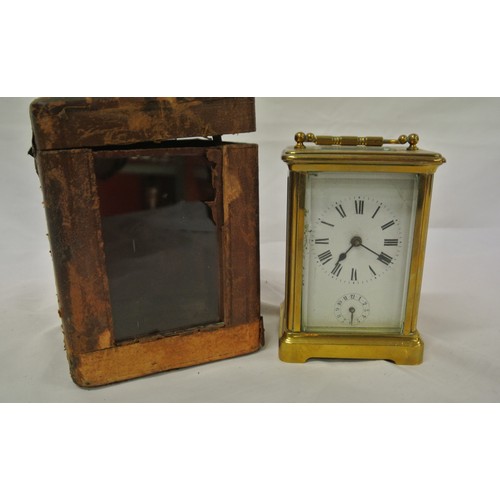 286 - French style brass cased carriage clock with enamel dial and shaped handle, in carrying case