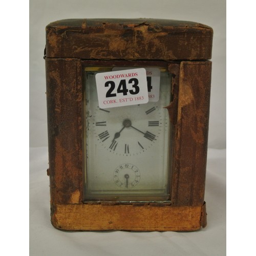 286 - French style brass cased carriage clock with enamel dial and shaped handle, in carrying case