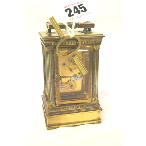 292 - Swiss brass cased small carriage clock with bevelled windows and enamel face, retailed by Matthew No... 