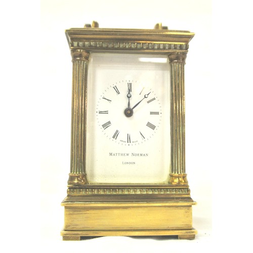 292 - Swiss brass cased small carriage clock with bevelled windows and enamel face, retailed by Matthew No... 