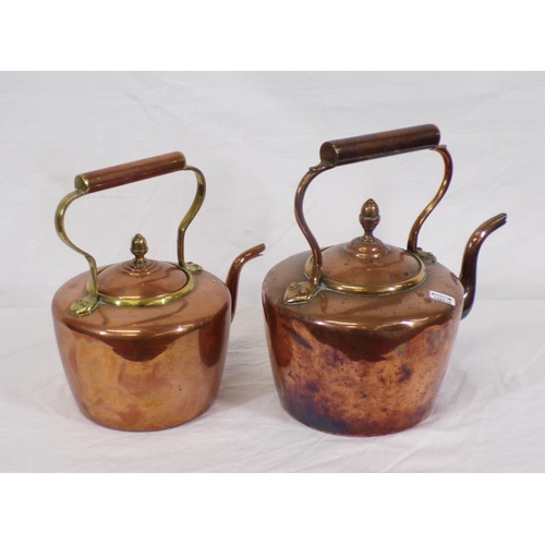 117 - Two Georgian copper kettles with shaped handles and spouts