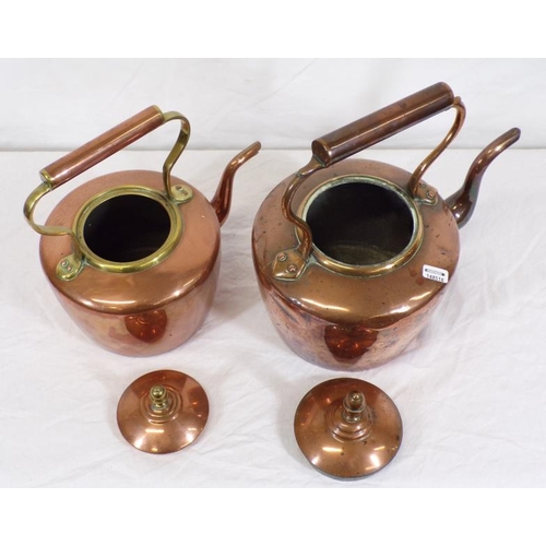 117 - Two Georgian copper kettles with shaped handles and spouts