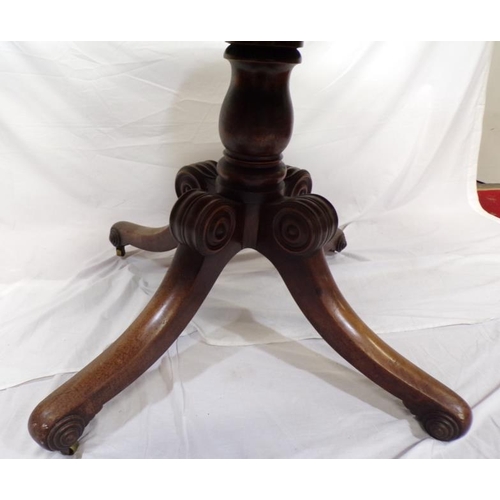 125 - Victorian mahogany round library or dining table, raised on baluster column, on scroll decorated qua... 