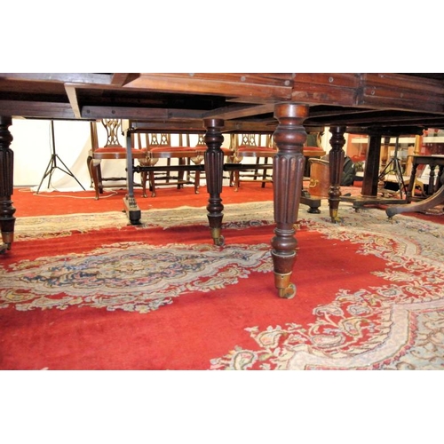 210 - Victorian mahogany extending dining table with rounded borders, two extra leaves inset, raised on fi... 