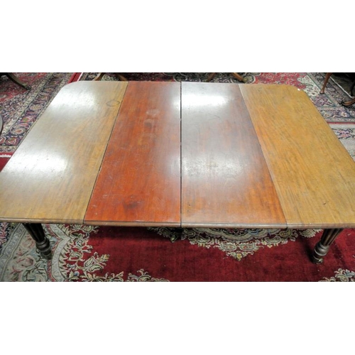 210 - Victorian mahogany extending dining table with rounded borders, two extra leaves inset, raised on fi... 