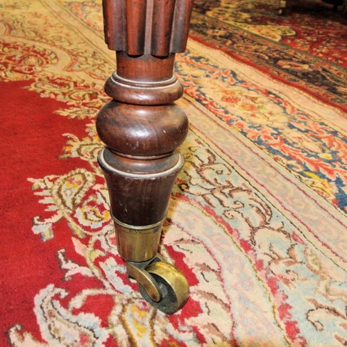 210 - Victorian mahogany extending dining table with rounded borders, two extra leaves inset, raised on fi... 