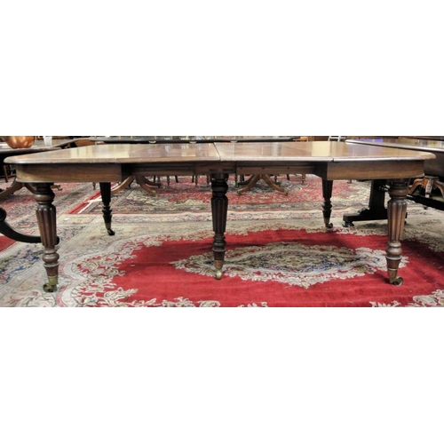 210 - Victorian mahogany extending dining table with rounded borders, two extra leaves inset, raised on fi... 