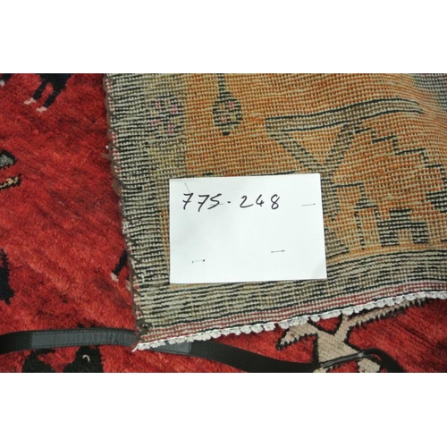 221 - Washed red ground vintage Iranian village runner wth large medallion desing and animal motifs