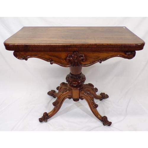 225 - Regency rosewood card table with swivel fold-over top,  round playing surface, with foliate decorate... 