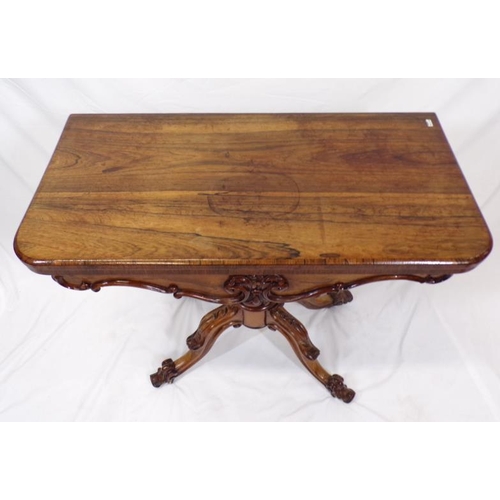 225 - Regency rosewood card table with swivel fold-over top,  round playing surface, with foliate decorate... 