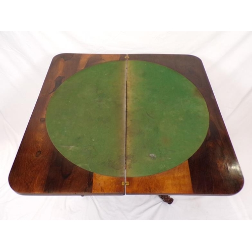 225 - Regency rosewood card table with swivel fold-over top,  round playing surface, with foliate decorate... 