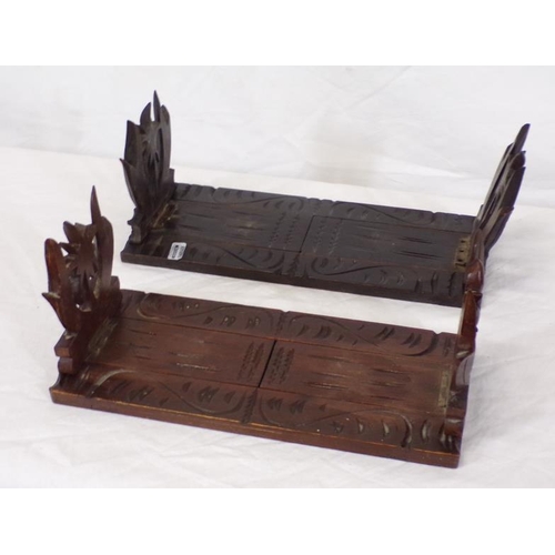 28 - Pair of 'Black Forest' carved adjustable bookends with foliate decoration