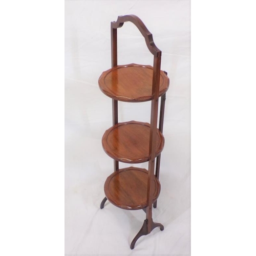 31 - Edwardian mahogany three tier round cake stand with shaped handle