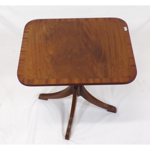 51 - Edwardian style mahogany occasional table with rounded borders, turned column, on reeded quadrapod