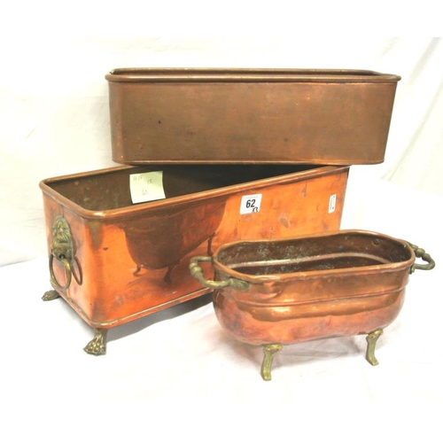 62 - Three oblong copper planters, two with shaped handles and shaped feet