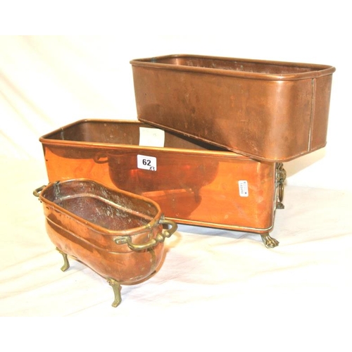 62 - Three oblong copper planters, two with shaped handles and shaped feet