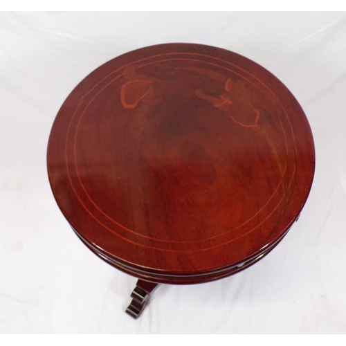 66 - Round inlaid teak occasional table with two bowed drawers, brass handles, on turned column, on conca... 