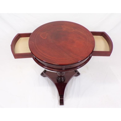 66 - Round inlaid teak occasional table with two bowed drawers, brass handles, on turned column, on conca... 