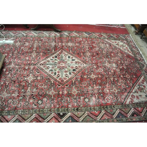 84 - Washed red ground hand woven Persian Hamadan Lori village rug