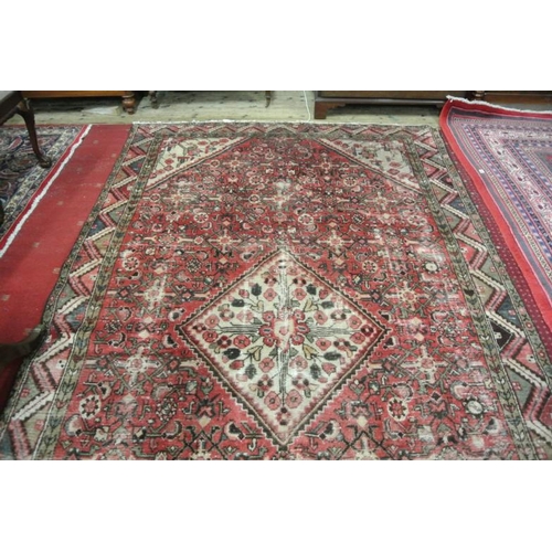 84 - Washed red ground hand woven Persian Hamadan Lori village rug