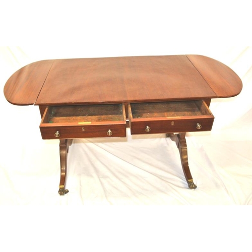 90 - Edwardian mahogany sofa table with D-shaped drop leaves, pull-out supports, two frieze drawers with ... 