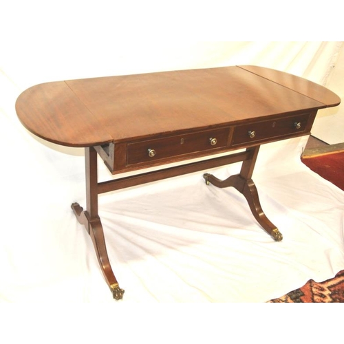 90 - Edwardian mahogany sofa table with D-shaped drop leaves, pull-out supports, two frieze drawers with ... 