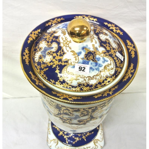 92 - Large Staffordshire urn with ornate gilt blue and white foliate decoration, lid with round finial, o... 