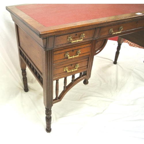 95 - Edwardian oblong desk with leatherette inset, three frieze and four side drawers with ornate brass d... 