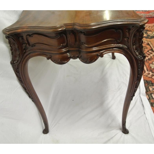 99 - Victorian mahogany centre or occasional table with serpentine borders, foliate and scroll decoration... 