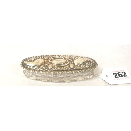 262 - Oval Birmingham silver topped hairpin box with ornate foliate decoration