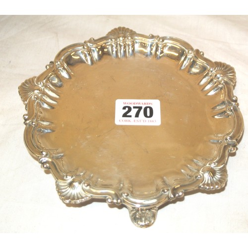 270 - Sheffield silver salver with ornate scroll and shell decoration, on three cast feet 180g 15.5cm diam