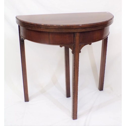 51 - Edwardian mahogany demi-lune card table with fold-over top, pull-out support, reeded borders, on squ... 