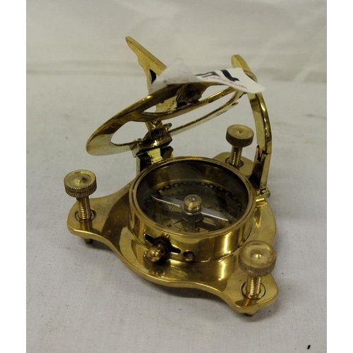 144 - Mariners miniature brass hand held compass with folding top and round dial